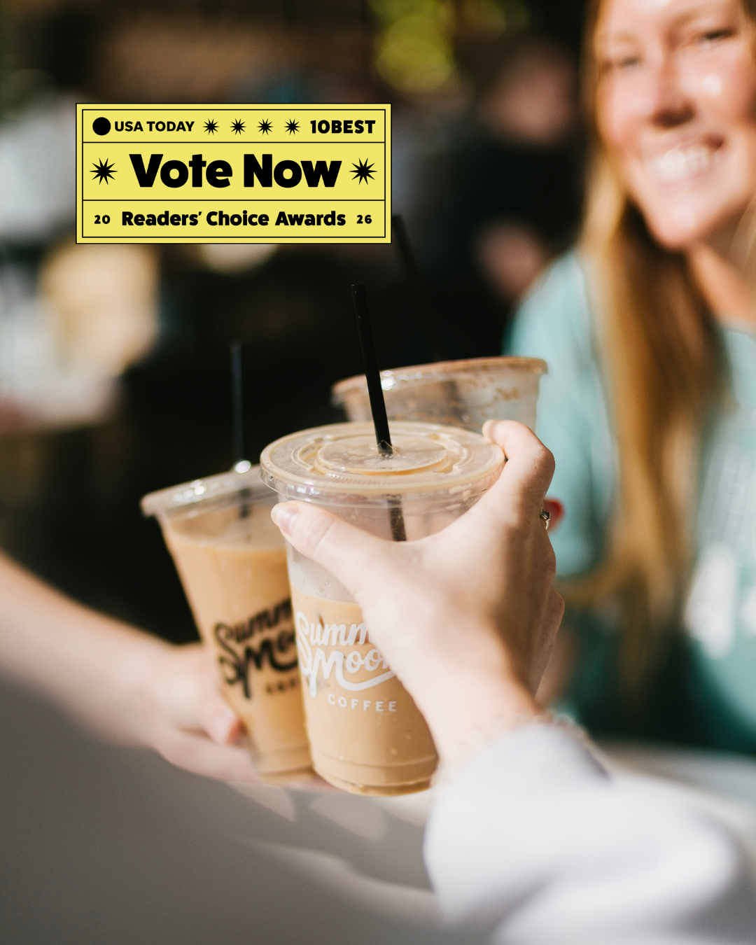 Friends toasting with iced Summer Moon Coffee drinks, with a USA TODAY 10BEST Readers’ Choice Awards 2026 ‘Vote Now’ badge.