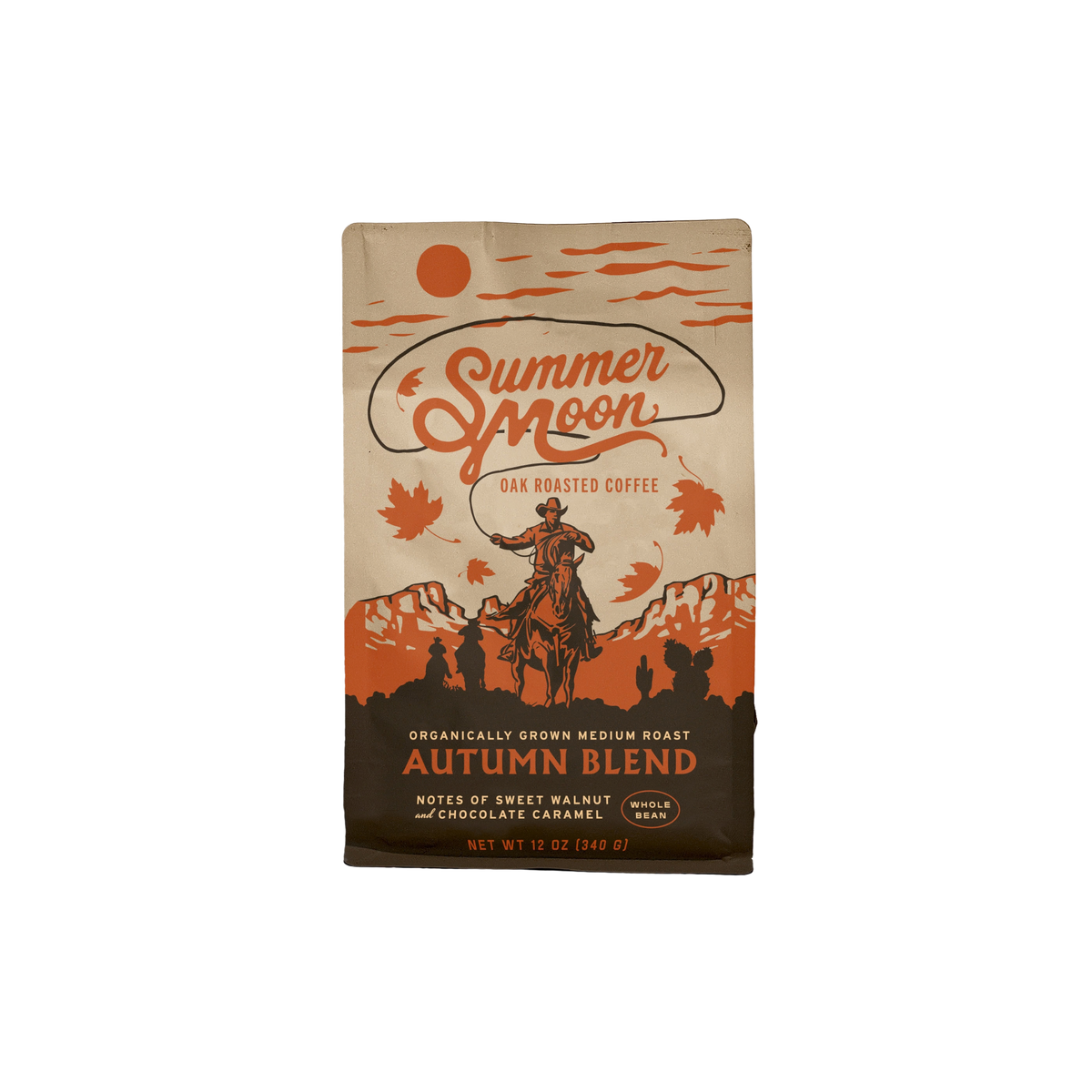 A bag of Summer Moon Autumn Blend Oak Roasted Coffee on a plain white background. The packaging features a vintage western design with an illustration of a cowboy on a horse, mountains, and orange autumn leaves on a tan background.