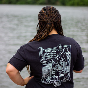 A back view of a black t-shirt with a white line art graphic print.